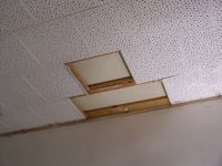 Cardboard ceiling with three tiles missing