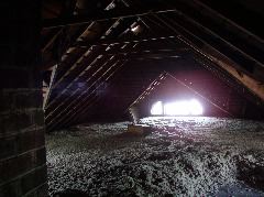Lunar landscape?  No, just blown insulation in the full attic.